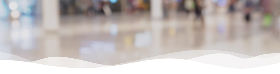 Verschwommener Hintergrund einer hellen Ladenpassage